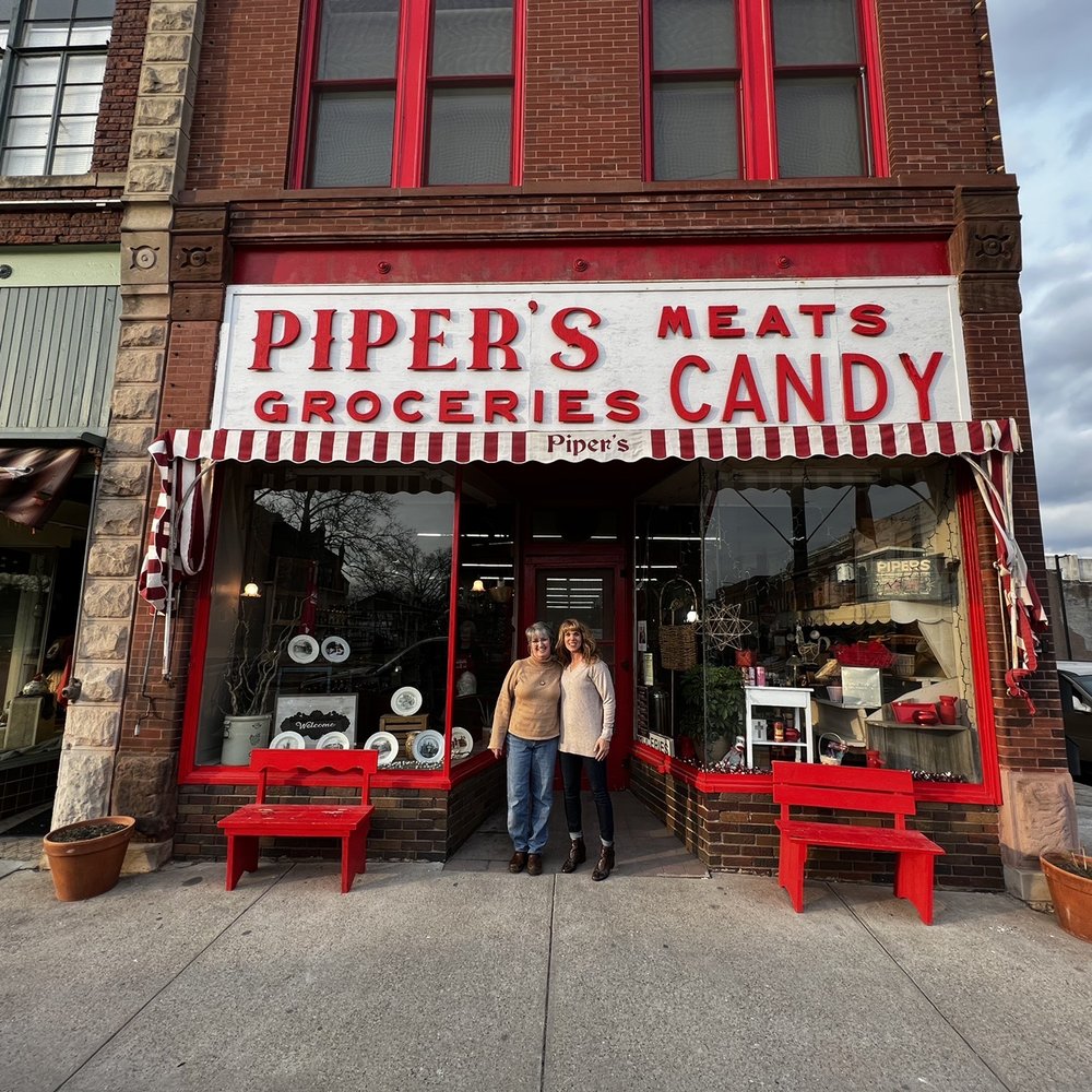 Piper's Groc-Candy - two people standing in front of a store - Grocery Near Me - Chariton, Iowa