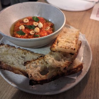 Barbarella Bar - a bowl of soup and bread on a plate - Italian Near Me - Calgary, Alberta Barbarella Bar - a bowl of soup and bread on a plate - Italian Near Me - Calgary, Alberta