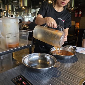 All That Shabu - Broth being poured into our hot pots - Hot Pot Near Me - San Diego, California
