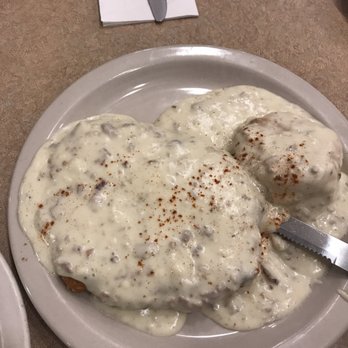 Bill's Cafe - Country fried steak with a biscuit all smothered in gravy. Comes with 3 eggs and hash browns or potatoes for $12.95 - American Near Me - San Jose, California Bill's Cafe - Country fried steak with a biscuit all smothered in gravy. Comes with 3 eggs and hash browns or potatoes for $12.95 - American Near Me - San Jose, California