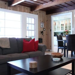 The Cottage at Where Water Falls - Living room with kitchen in background