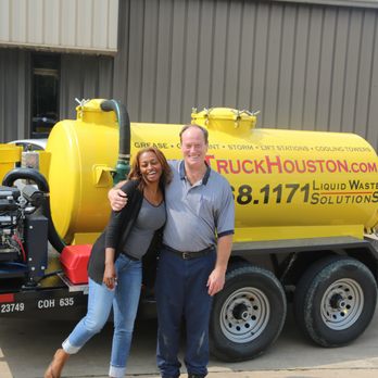Liquid Waste Solutions - Leah and Steve in front of out new unit tat stands at only 6'6" tall - Hazardous Waste Disposal Near Me - Houston, Texas