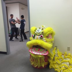 Richmond Moy Yat Kung Fu Academy - Students training at the Richmond Moy Yat Kung Fu Academy - view from the lobby with Lion Dance display.
