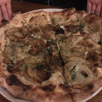 Mioposto - Potato pizza is the bizz!!!!! With truffle oil and thinly sliced potatoes. - Italian Near Me - Seattle, Washington Mioposto - Potato pizza is the bizz!!!!! With truffle oil and thinly sliced potatoes. - Italian Near Me - Seattle, Washington