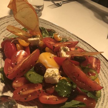 Doris Metropolitan - Tomato Salad (several tomatoes, Moroccan oils, greens, egg yolk, & feta) - Steakhouses Near Me - Houston, Texas Doris Metropolitan - Tomato Salad (several tomatoes, Moroccan oils, greens, egg yolk, & feta) - Steakhouses Near Me - Houston, Texas
