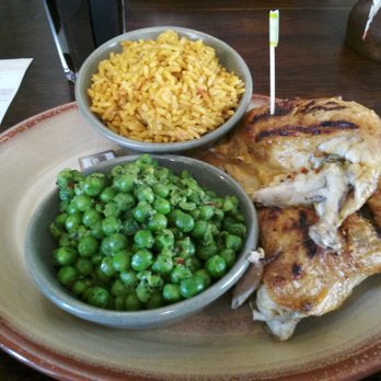 Nando's - 1/2 chicken combo with dark meat, spicy rice, and macho peas - Chicken Shop Near Me - London, XGL Nando's - 1/2 chicken combo with dark meat, spicy rice, and macho peas - Chicken Shop Near Me - London, XGL