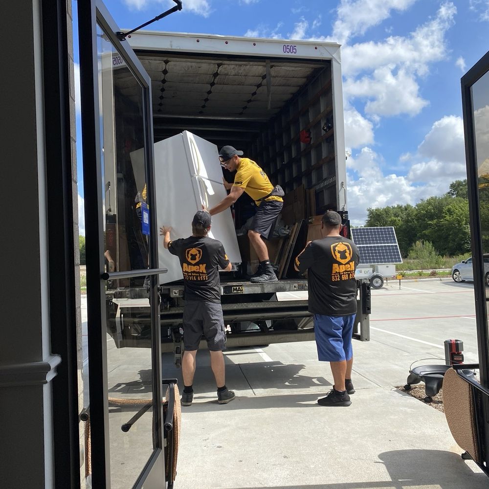ApeX Moving And Delivery Services - Movers offloading a fridge - Movers Near Me ApeX Moving And Delivery Services - Movers offloading a fridge - Movers Near Me