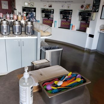 Oodles Frozen Yogurt - a counter with a variety of frozen yogurts - Ice Cream & Frozen Yogurt Near Me - Modesto, California