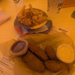 Rock poppers and a half order of garlic crab fries Rock poppers and a half order of garlic crab fries