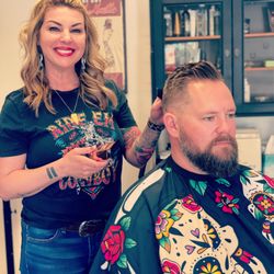 Barbed Wire Barber Salon - Dani doing a haircut and beard trim