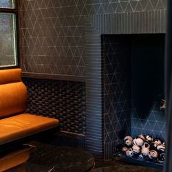 Every detail counts. Zoom in on our Legacy Lounge fireplace--bricks & tiles by @erinmartindesign add warmth and texture.