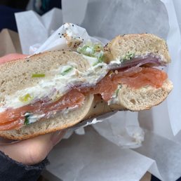 Smoke salmon, scallion cream cheese, red onions on toasted everything bagel Smoke salmon, scallion cream cheese, red onions on toasted everything bagel