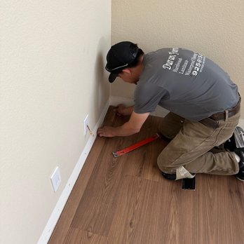 Duran Flooring - Luis places the final piece in the corner - Flooring Near Me Duran Flooring - Luis places the final piece in the corner - Flooring Near Me