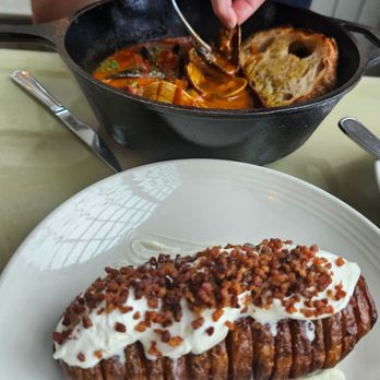 Scales - Back: seafood stew Front: hasselback potatoe (minus pickled red onions on top) - Seafood Near Me - Portland, Maine Scales - Back: seafood stew Front: hasselback potatoe (minus pickled red onions on top) - Seafood Near Me - Portland, Maine
