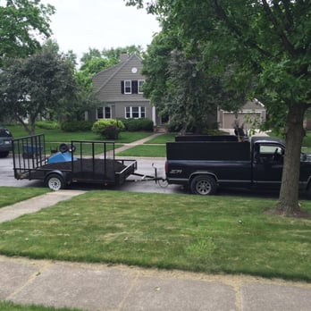Monarch Landscape - a black pickup truck pulling a trailer - Landscaping Near Me - Columbus, Ohio Monarch Landscape - a black pickup truck pulling a trailer - Landscaping Near Me - Columbus, Ohio