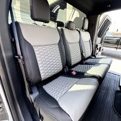 Ford F150 Super Cab STX rear bench with custom Alea Leather seat covers in Ebony and Pewter with Alveare Doppio inserts.