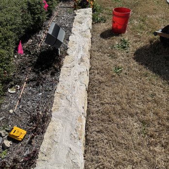 Cleveland Landscape and Tree - Stone flowerbed repaired for an HOA - Landscaping Near Me