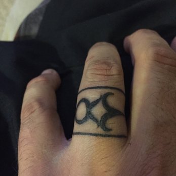 Goliath Tattoo Studio - Kissing horns - Piercing Near Me - Phoenix, Arizona