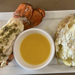 Lobster tail, baked potato, salad and dessert Lobster tail, baked potato, salad and dessert