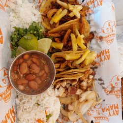 Ayy Mama Taqueria - Four tacos and side of beans and rice! The food is very good and fresh! My third time having food from here!