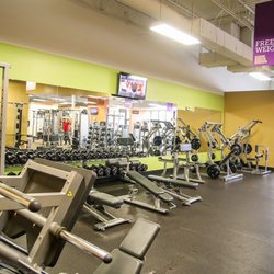 Anytime Fitness - Our large free weight area with dumbbells up to 100, fixed barbells up to 110, thousands of pounds of free weights.