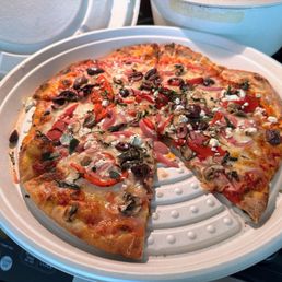 Central Market pizza (all veg) in its take-out compostable container Central Market pizza (all veg) in its take-out compostable container