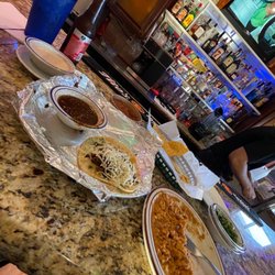 Sombrerito Mexican Restaurant - Bar area. Full bar, tv, one of three of my remaining steak tacos, chips, salsa, queso dip. Beer was cold as well.