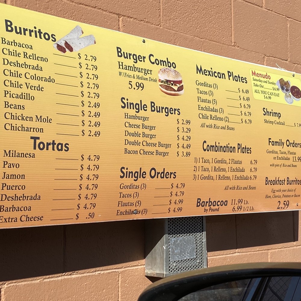 a menu on a brick wall a menu on a brick wall