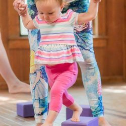 Three Rivers Yoga - Toddlers practicing her balance in the Free Toddler Yoga class every Saturday except the 1st Saturday.