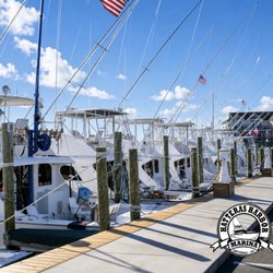 Hatteras Blue Charters - Hatteras Harbor Marina Dock Boat Slips with Logo