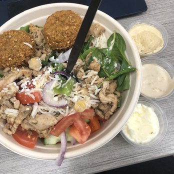 Chickpz - a salad in a bowl with a fork - Mediterranean Near Me - London, Ontario Chickpz - a salad in a bowl with a fork - Mediterranean Near Me - London, Ontario