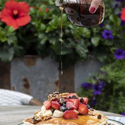 Pancake perfection in the shed Loaded with strawberries, chocolate chips, bananas, and walnuts--just how we like it.