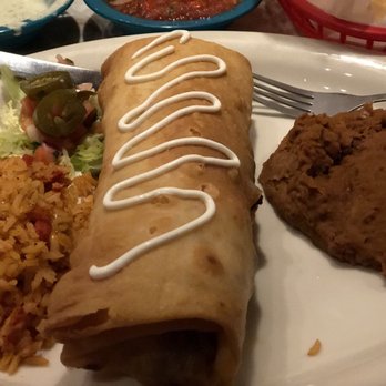Chuy's - Chuychanga* with fajita steak. Spanish rice and refried beans - Tex-Mex Near Me - Lutz, Florida
