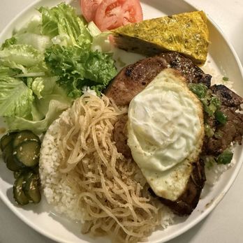 Huynh - Rice plate w/pork chop, fried egg, shredded pork, and egg cake. - Vietnamese Near Me - Houston, Texas Huynh - Rice plate w/pork chop, fried egg, shredded pork, and egg cake. - Vietnamese Near Me - Houston, Texas