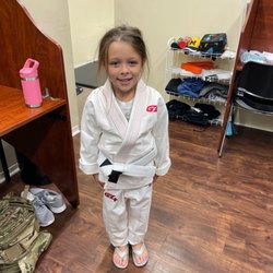 American Black Belt Academy - Emilia age 6 training BJJ for the first time at American Black Belt Academy.  She wanted to tie her own belt, sorry its wrong.