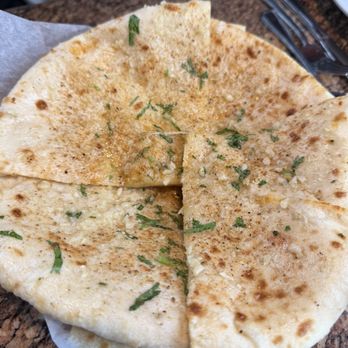 Haldi Indian Cuisine and Bar - Garlic cheese Naan - Indian Near Me - Aurora, Colorado Haldi Indian Cuisine and Bar - Garlic cheese Naan - Indian Near Me - Aurora, Colorado