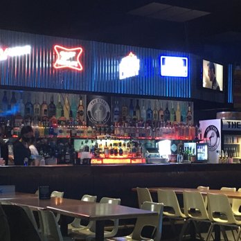 The Stage - a man sitting at a bar - Music Venues Near Me - Williamsville, New York