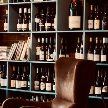 Dot's Fine Wine and Craft - two leather chairs in front of a wall of wine bottles - Beer, Wine & Spirits Near Me - Ball Ground, Georgia Dot's Fine Wine and Craft - two leather chairs in front of a wall of wine bottles - Beer, Wine & Spirits Near Me - Ball Ground, Georgia