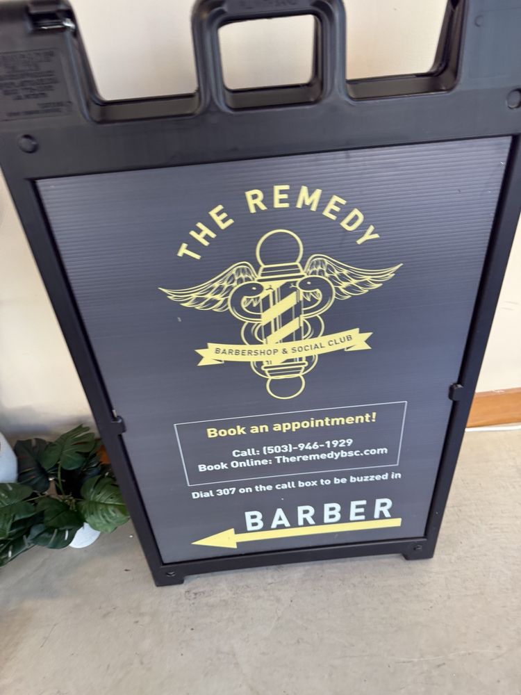 The Remedy Barbershop & Social Club Logo