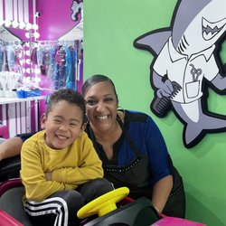Sharkey’s Cuts for Kids - Happy Eli with his new friend Nikki at Sharkeys in Marietta Ga. Jan 2023