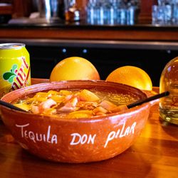 Amigos Grill Cocina Mexicana Y Cantina - The Cazuela de Don Pilar, our house cocktail. Made with Tequila Don Pilar, citrus juices, Squirt and fruit.