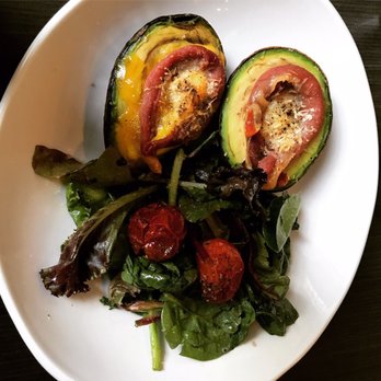 The Dark Room - Baked avocado. Delicious with a perfect runny egg, prosciutto, and manchego cheese. The roasted tomatoes on the side were wonderful. - Wine Bars Near Me - Saint Louis, Missouri