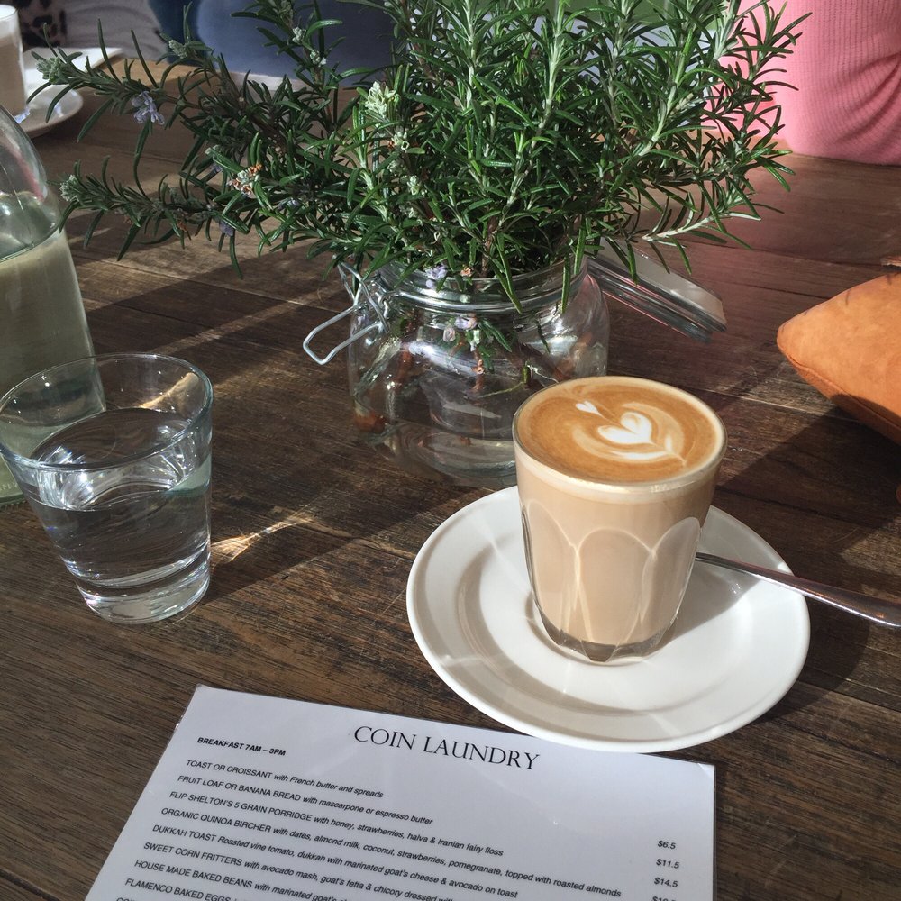 Cafe latte on the communal table Cafe latte on the communal table