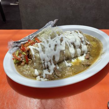 El Chapin - A Pork Green Chili Smothered Burrito the complexity of the green chile sauce was amazing! - Food Trucks Near Me - Colorado Springs, Colorado El Chapin - A Pork Green Chili Smothered Burrito the complexity of the green chile sauce was amazing! - Food Trucks Near Me - Colorado Springs, Colorado