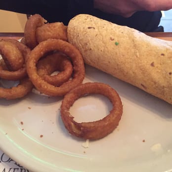 Moab Brewery - Half of the Southwest Chicken wrap and onion rings (order was split in 2 and shared) - American Near Me - Moab, Utah