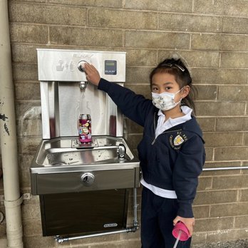 St. Bede Catholic School - GAP purchased a water bottle filling station for the school. A happy Hornet shows how to use it. - Elementary Schools Near Me - Hayward, California