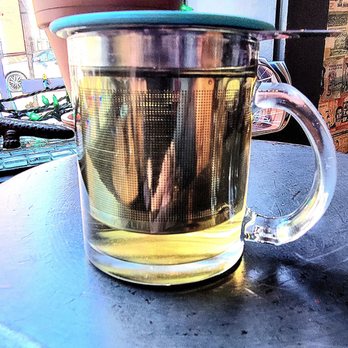 ESP Tea and Coffee - Yaupon herbal tea with a tea infuser in the glass mug. - Coffee & Tea Near Me - Alexandria, Virginia