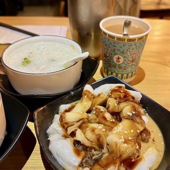 Cha Kee - Thousand years egg and pork congee + Rice noodle rolls with mixed sauce + HK milk tea breakfast set - Chinese Near Me - New York, New York Cha Kee - Thousand years egg and pork congee + Rice noodle rolls with mixed sauce + HK milk tea breakfast set - Chinese Near Me - New York, New York