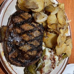 K-Bob's Steakhouse - Pan fried potatoes and grilled green chili with cheese and bacon.