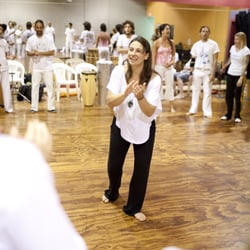 Brazilian Portuguese and Arts - Teaching Brazilian rhythms at a music and dance workshop.